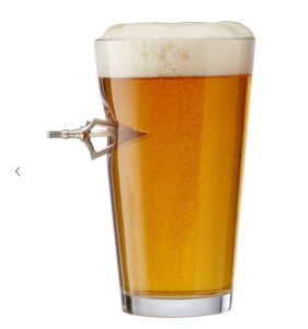 Broadhead from an arrow penetrating a beer glass