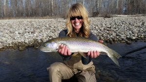 Kat Hobza with a 22" rainbow trout, caught on the Bitterroot River
